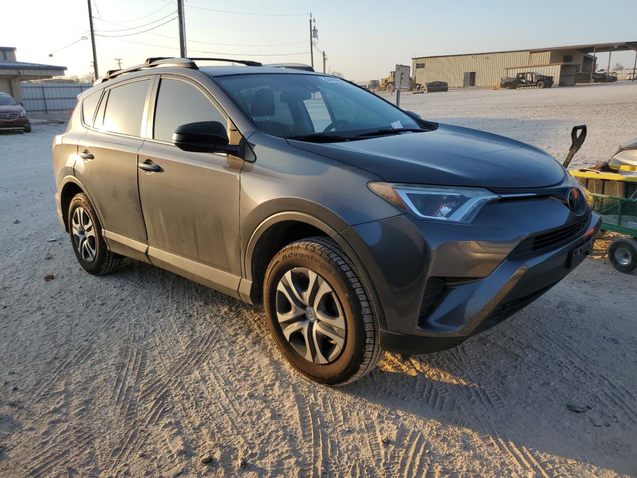 2018 Toyota RAV 4 VIN 2T3BFREVXJW772311 Copart auction photo, side / all over damage thumbnail 4