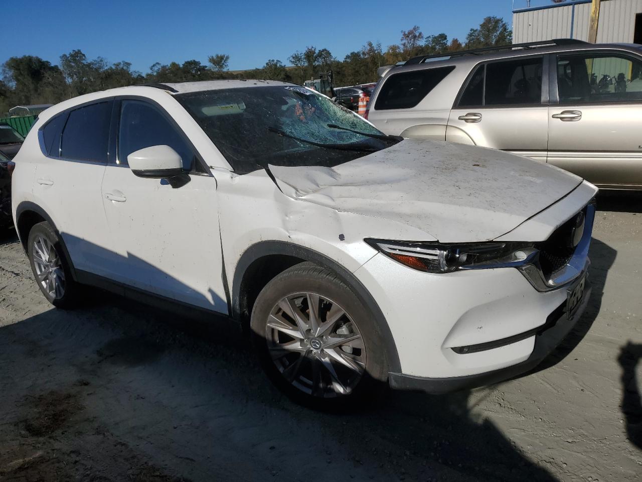 2021 Mazda CX-5 VIN JM3KFBDM6M1390237 Copart auction photo, top/roof damage thumbnail 4