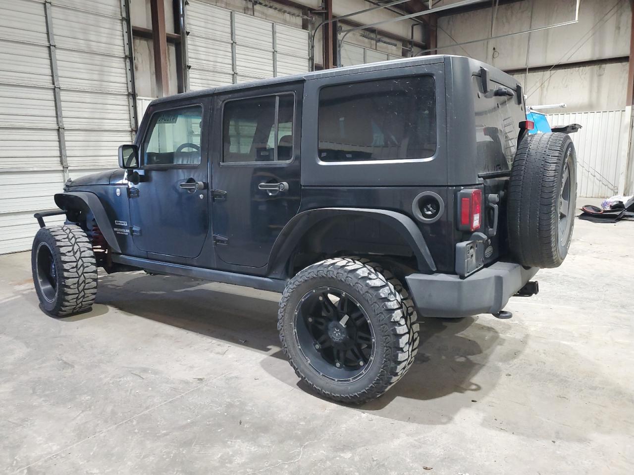 2015 Jeep Wrangler VIN 1C4BJWDG2FL557127 Copart auction photo, side / minor dent/scratches damage thumbnail 2