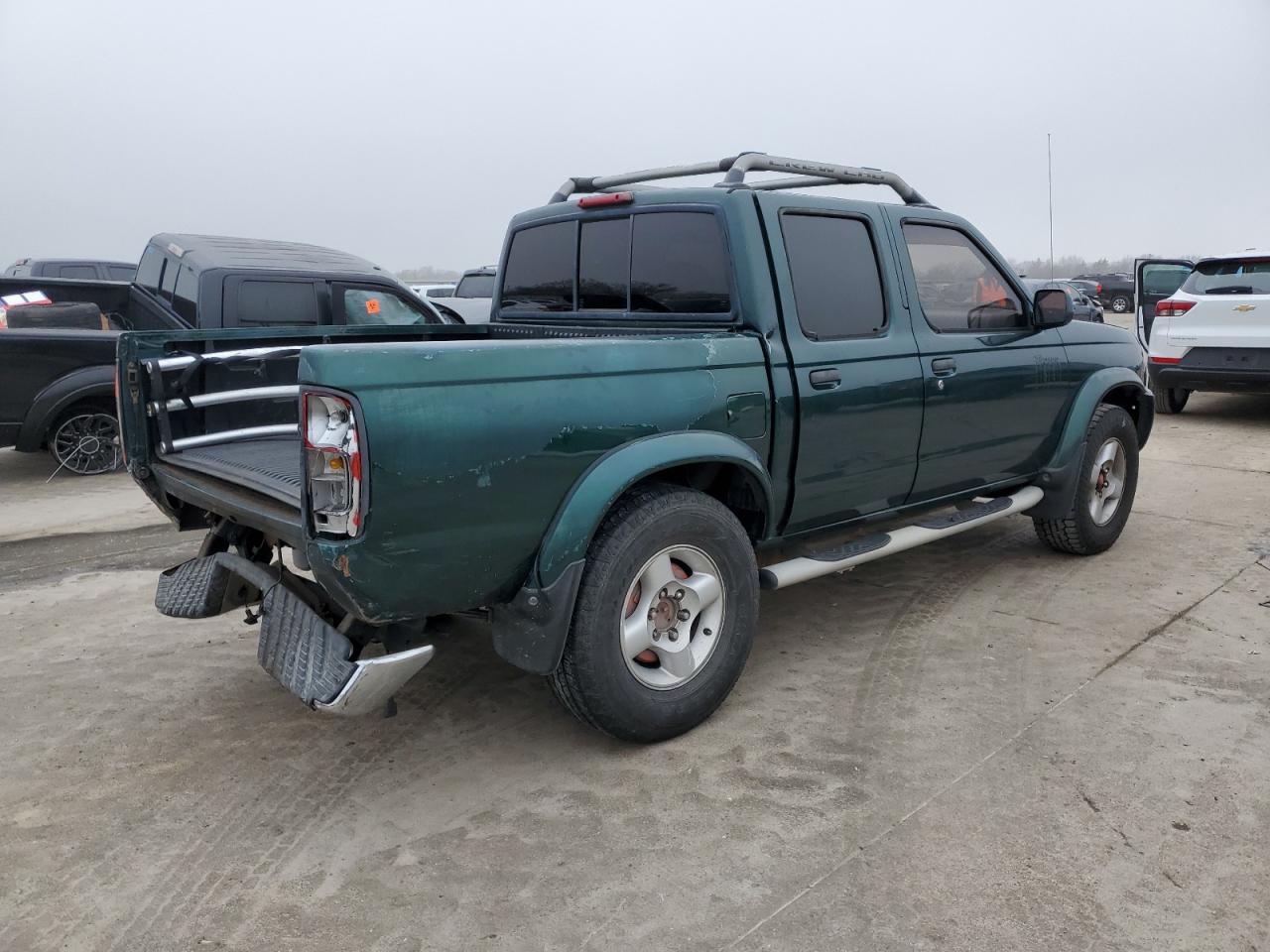 2000 Nissan Navara (Frontier) VIN 1N6ED27T1YC430410 Copart auction photo, rear end / front end damage thumbnail 3