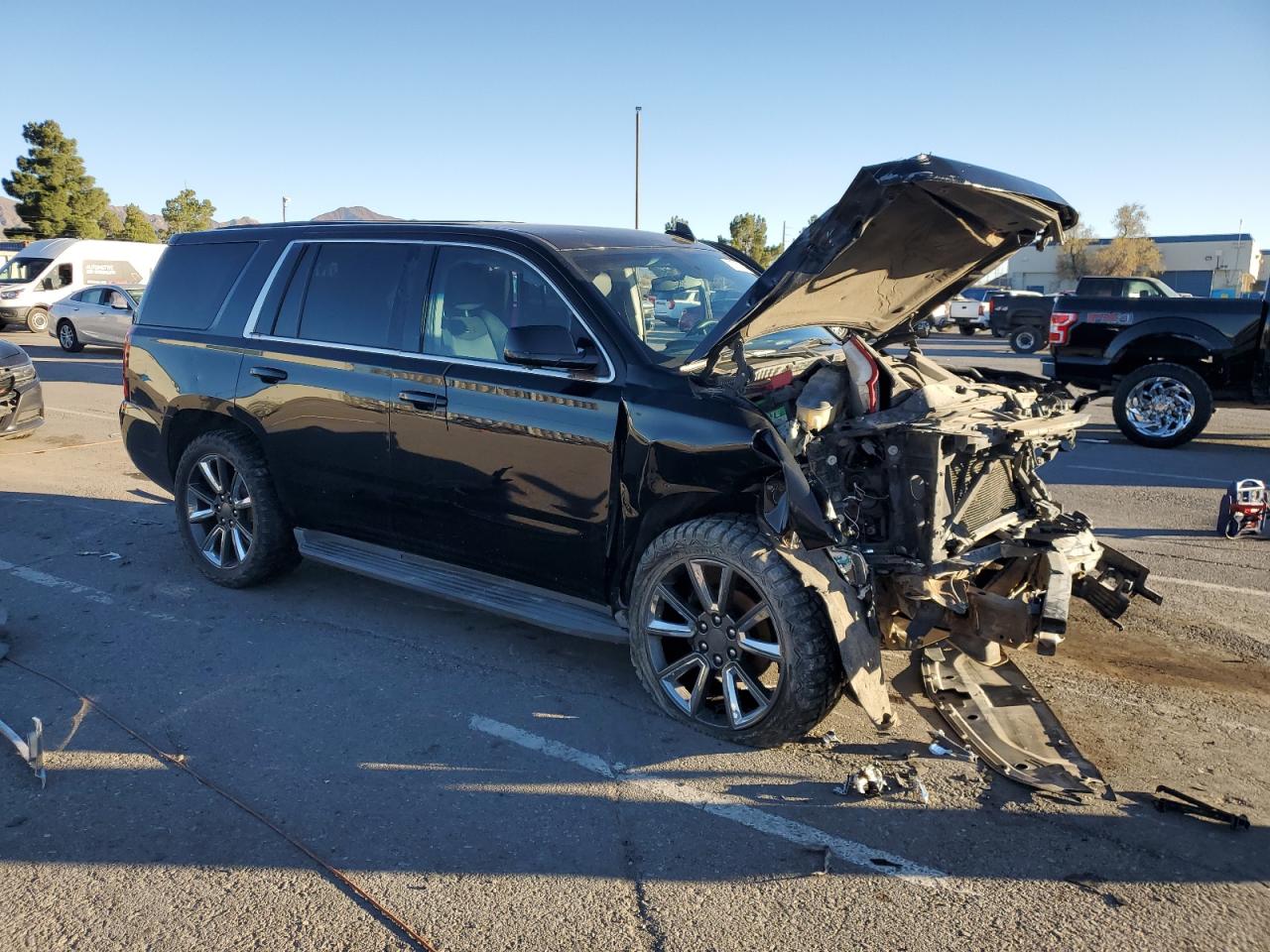 2015 Chevrolet Tahoe VIN 1GNLC2EC1FR555683 Copart auction photo, front end / side damage thumbnail 4
