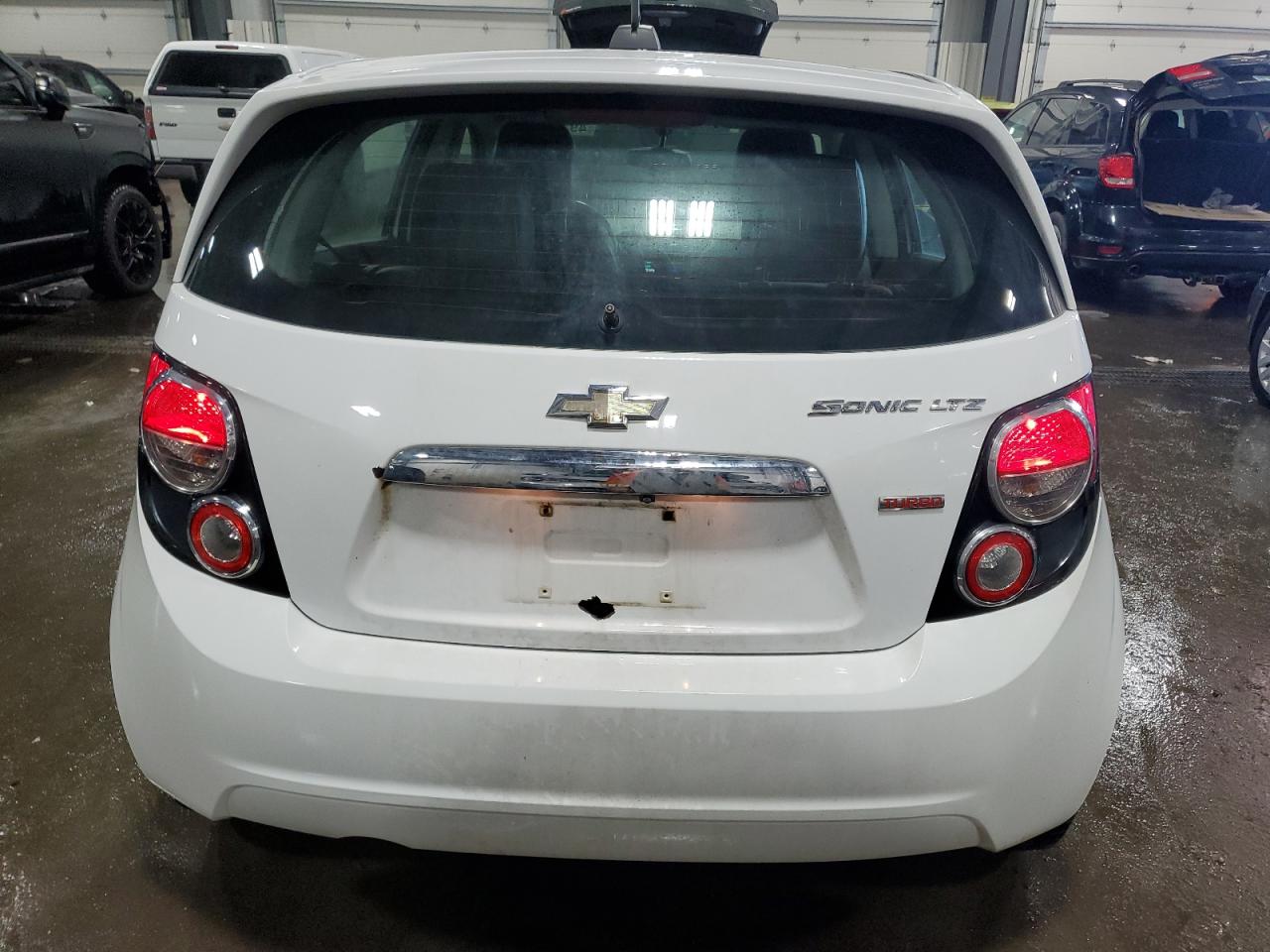 2015 Chevrolet Sonic VIN 1G1JE6SB7F4181647 Copart auction photo, minor dent/scratches damage thumbnail 6