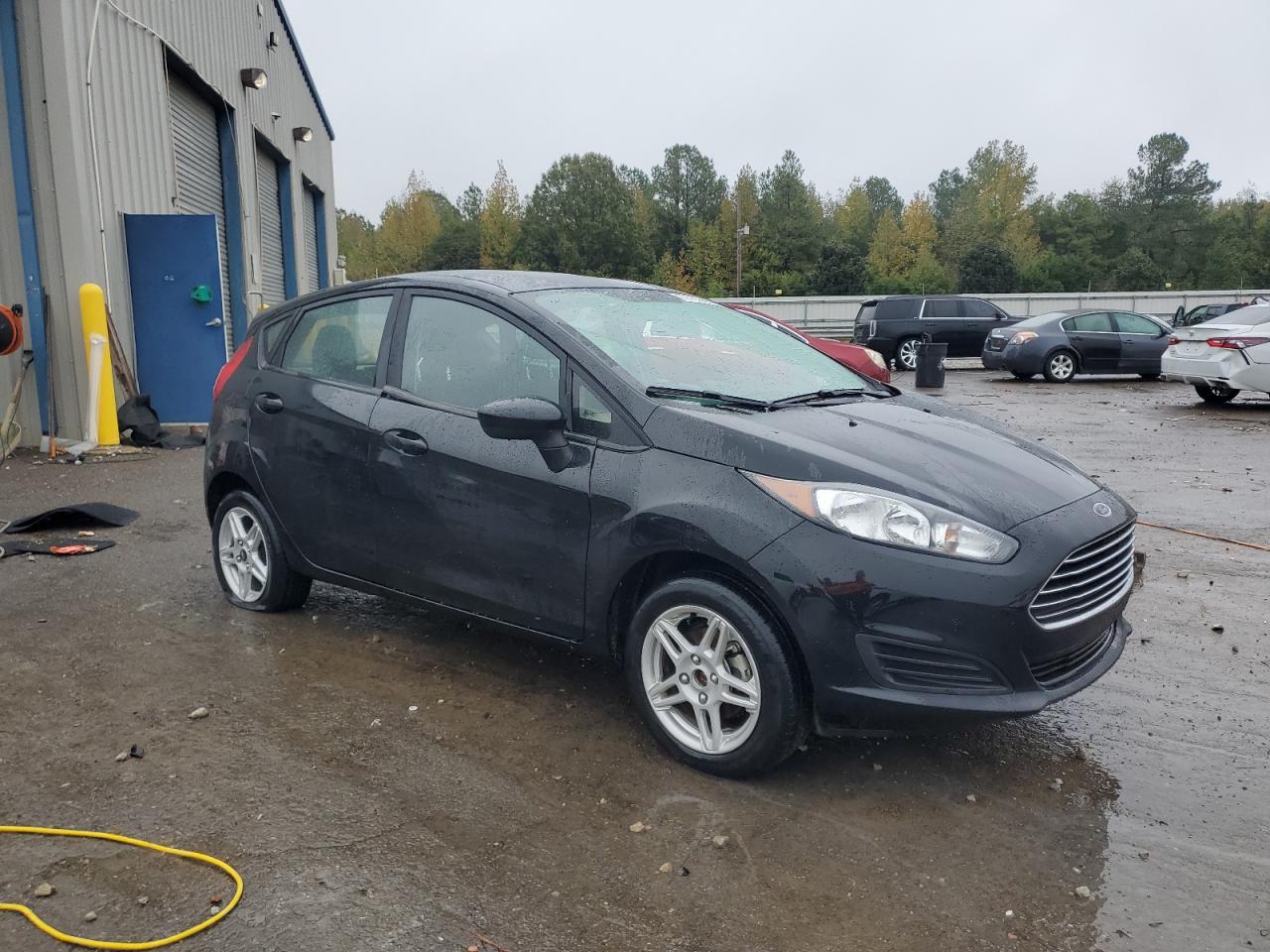 2017 Ford Fiesta VIN 3FADP4EJ6HM158749 Copart auction photo, side / rear end damage thumbnail 4