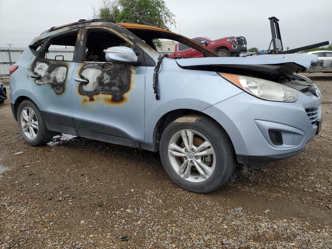 2012 Hyundai Tucson VIN KM8JU3AC8CU337995 Copart auction photo, burn - interior / burn damage thumbnail 4
