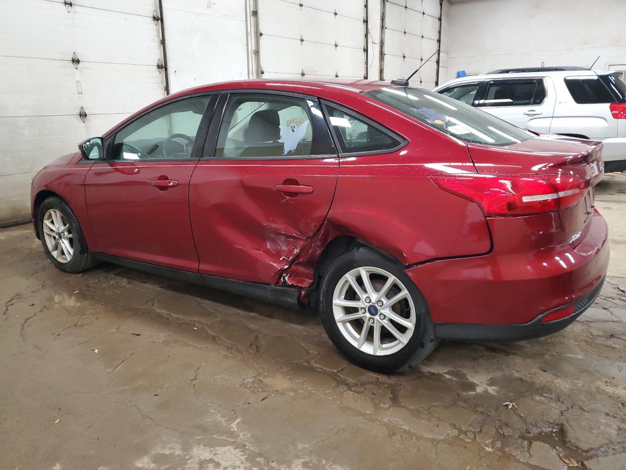 2015 Ford Focus VIN 1FADP3F21FL293282 Copart auction photo, side / rear end damage thumbnail 2