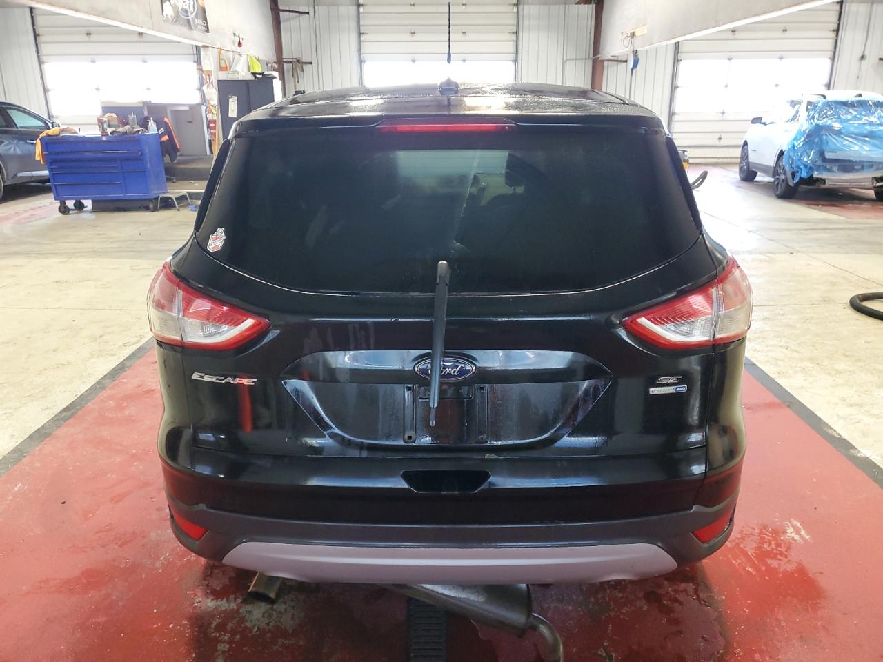 2016 Ford Escape VIN 1FMCU9GX5GUA06299 Copart auction photo, all over damage thumbnail 6