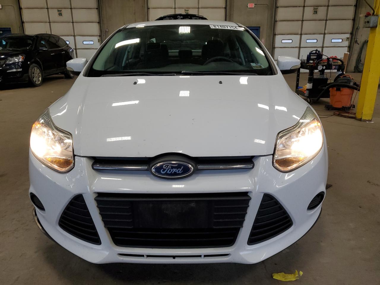 2014 Ford Focus VIN 1FADP3F21EL198185 Copart auction photo, all over damage thumbnail 5
