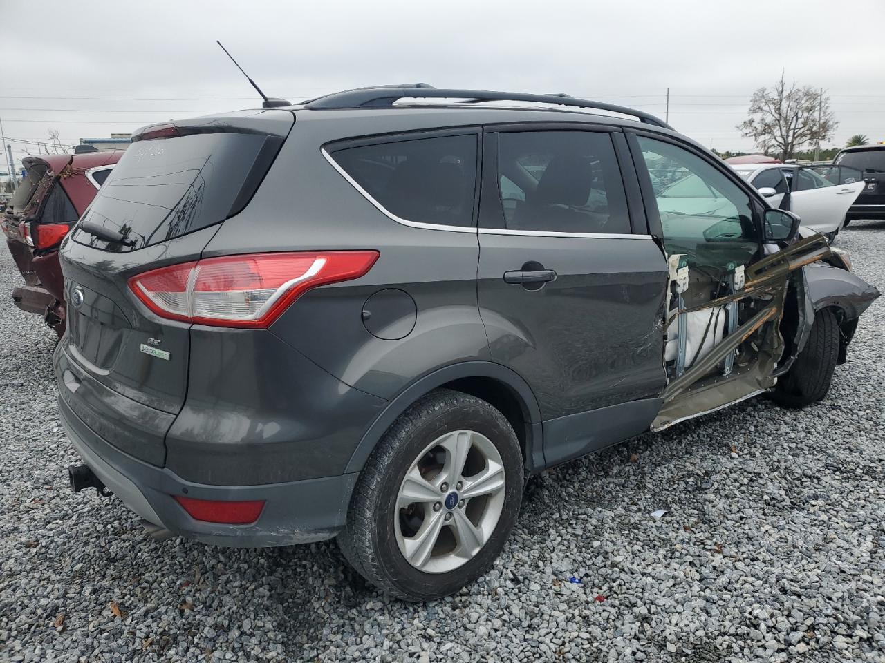 2015 Ford Escape VIN 1FMCU0G96FUC58459 Copart auction photo, side / front end damage thumbnail 3
