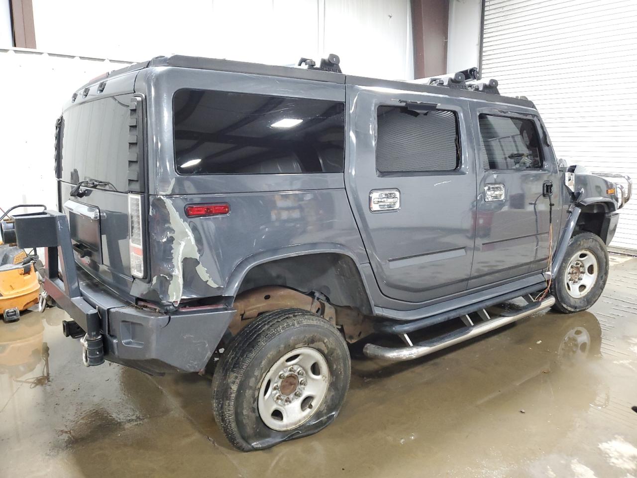 2003 Hummer H2 VIN 5GRGN23U73H127407 Copart auction photo, side / rear end damage thumbnail 3