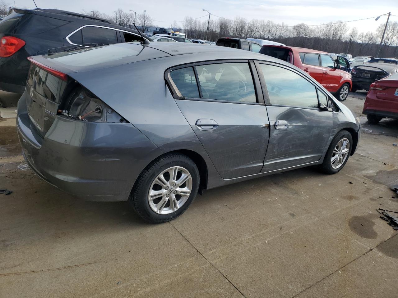 2010 Honda Insight VIN JHMZE2H7XAS010013 Copart auction photo, all over damage thumbnail 3