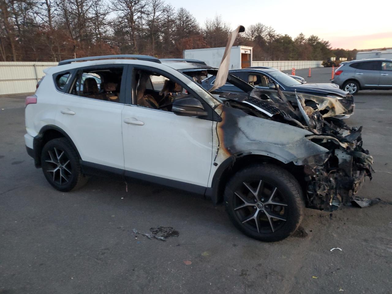 2018 Toyota RAV 4 VIN JTMJFREV6JJ233517 Copart auction photo, burn - engine / burn - interior damage thumbnail 4