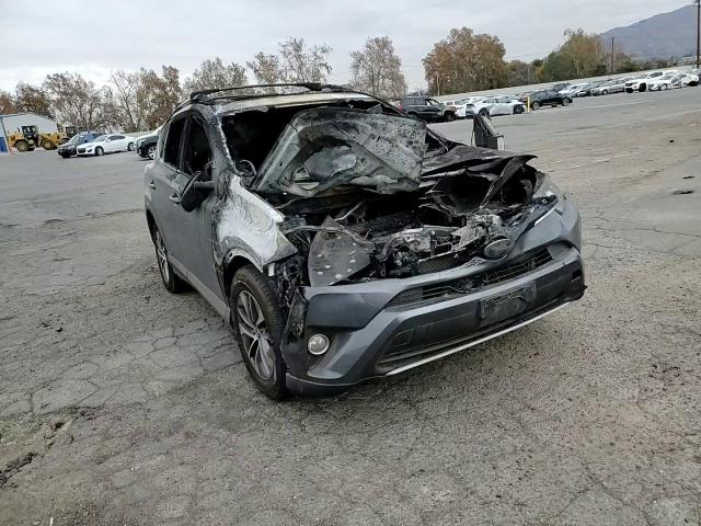2017 Toyota RAV 4 VIN JTMRJREV9HD063664 Copart auction photo, burn damage thumbnail 12