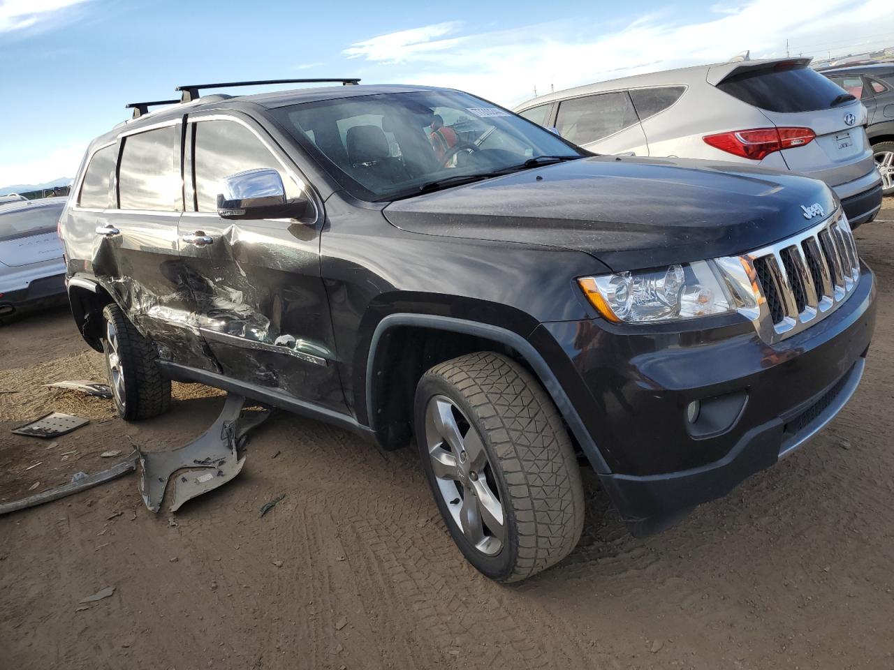 2011 Jeep Grand Cherokee VIN 1J4RR6GG5BC539745 Copart auction photo, side / rear end damage thumbnail 4