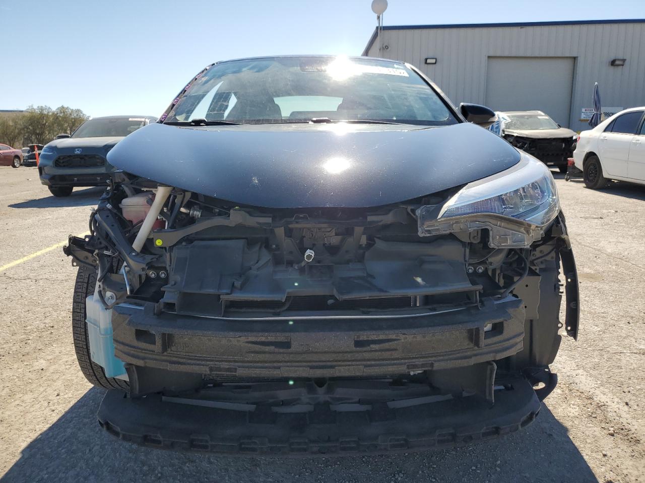 2021 Toyota C-HR VIN JTNKHMBX4M1115375 Copart auction photo, front end / side damage thumbnail 5