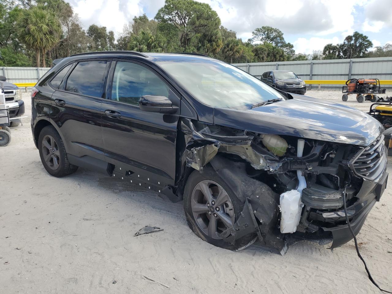 2023 Ford Edge VIN 2FMPK4J97PBA09778 Copart auction photo, front end / side damage thumbnail 4
