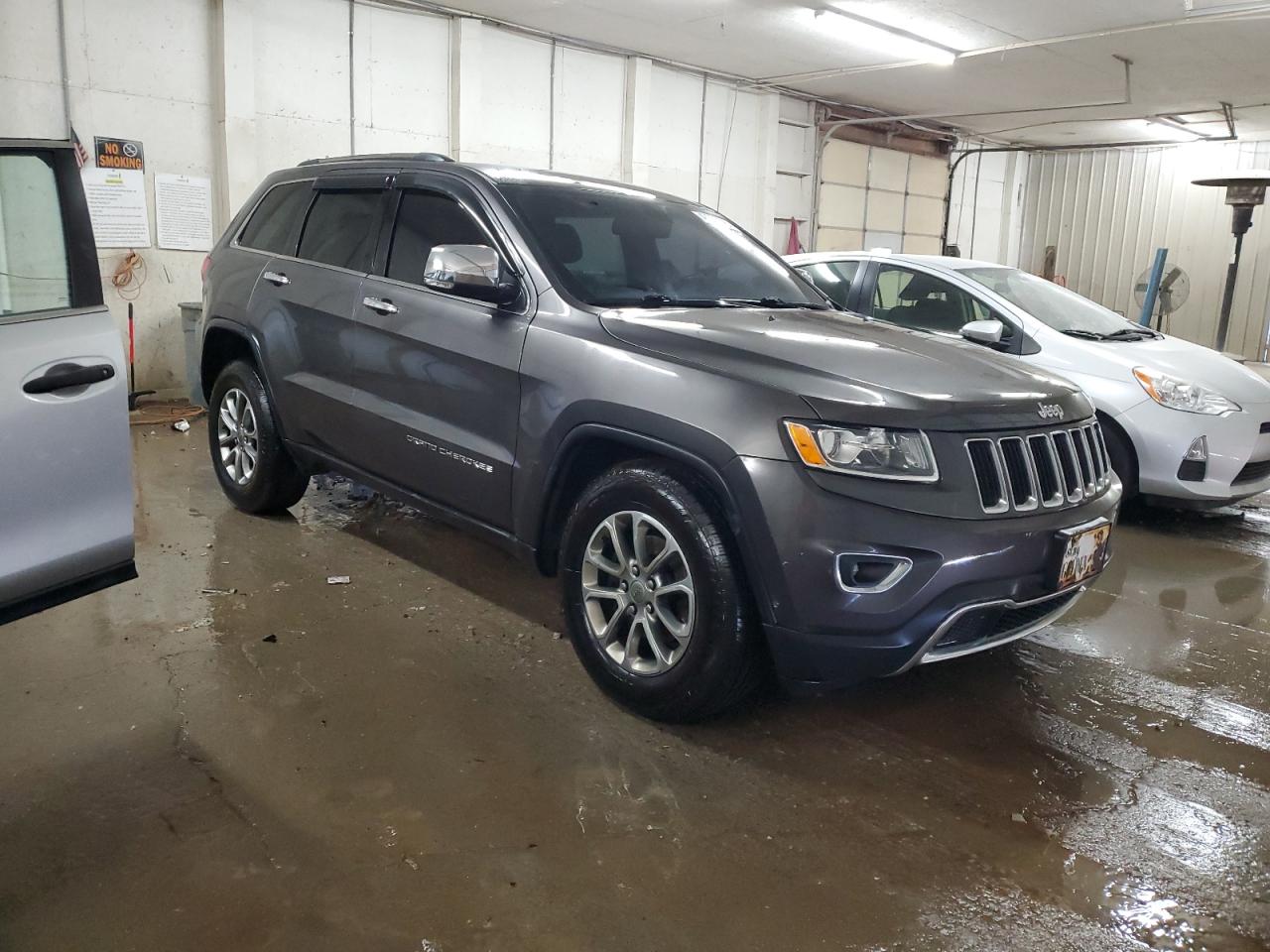 2015 Jeep Grand Cherokee VIN 1C4RJFBG2FC646326 Copart auction photo, front end / side damage thumbnail 4