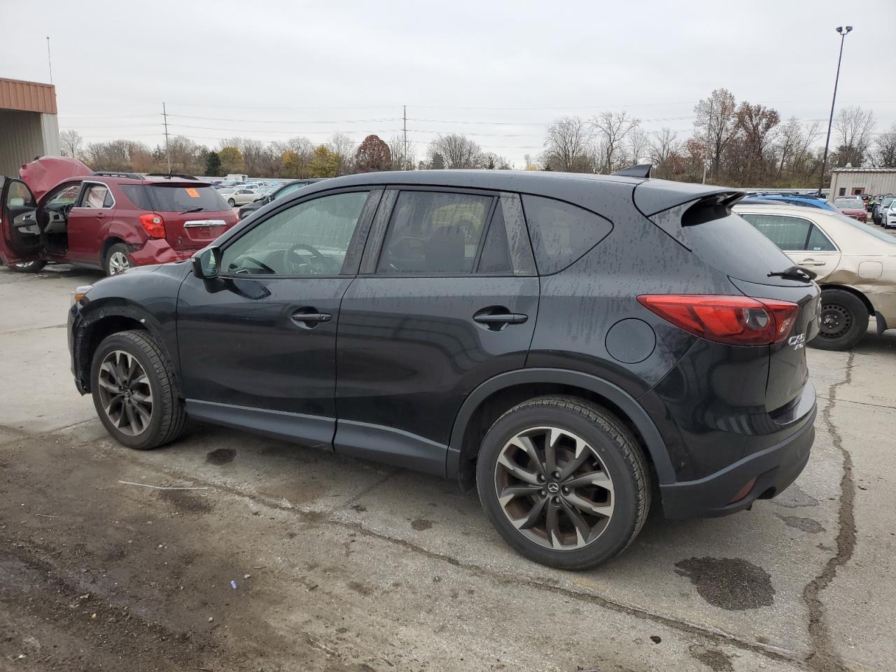 2016 Mazda CX-5 VIN JM3KE4DYXG0701969 Copart auction photo, side / rear end damage thumbnail 2