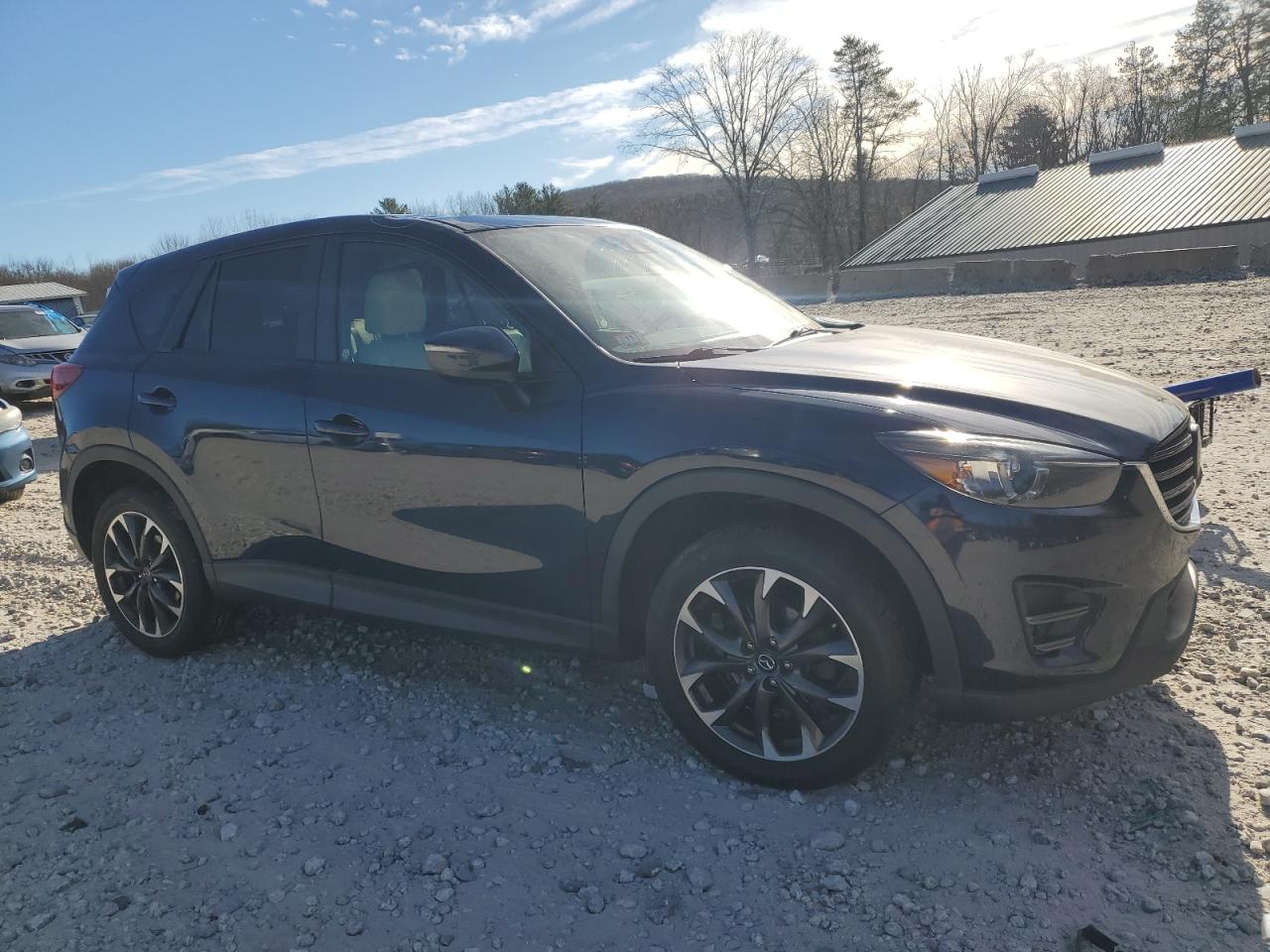 2016 Mazda CX-5 VIN JM3KE4DY3G0909515 Copart auction photo, top/roof damage thumbnail 4