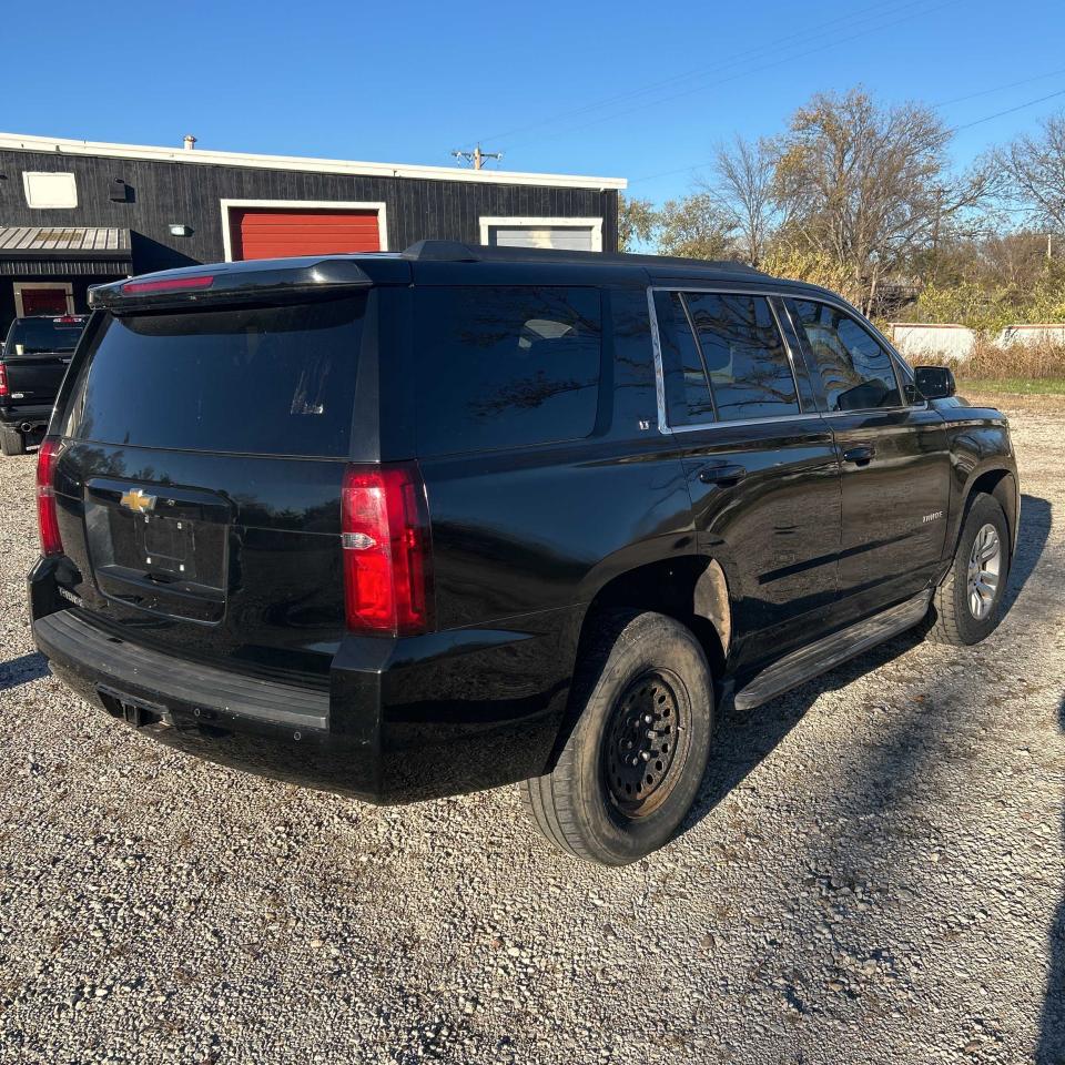 2015 Chevrolet Tahoe VIN 1GNSKBKC3FR159337 Copart auction photo, minor dent/scratches / normal wear damage thumbnail 4