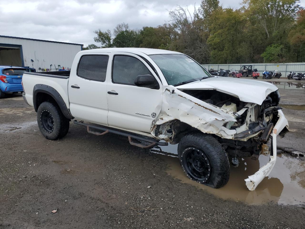 2014 Toyota Tacoma VIN 3TMLU4EN5EM137923 Copart auction photo, front end / side damage thumbnail 4