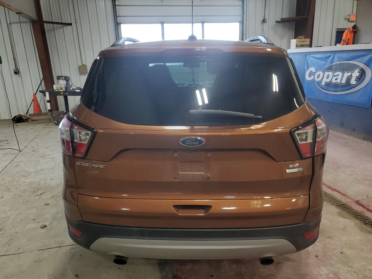 2017 Ford Escape VIN 1FMCU9G95HUC46262 Copart auction photo, all over damage thumbnail 6