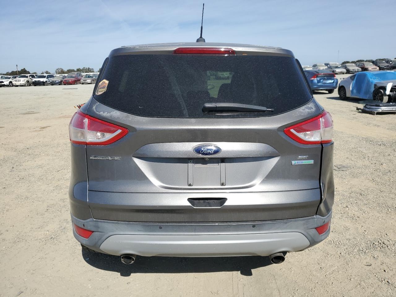 2014 Ford Escape VIN 1FMCU0GX3EUC00936 Copart auction photo, undercarriage / side damage thumbnail 6