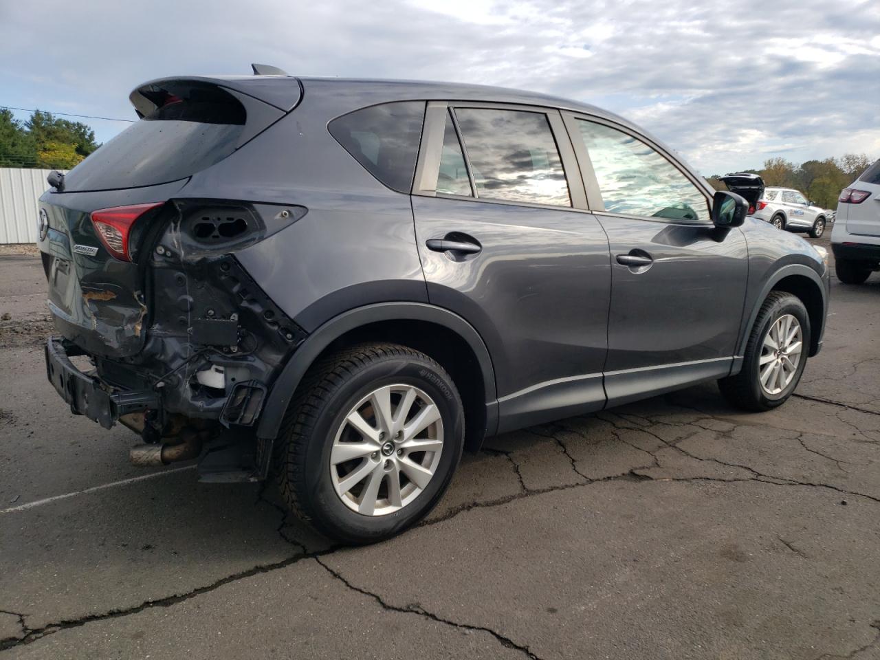 2014 Mazda CX-5 VIN JM3KE4CY4E0385502 Copart auction photo, rear end / minor dent/scratches damage thumbnail 3