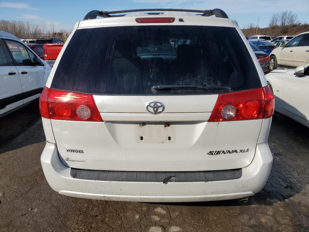 2010 Toyota Sienna VIN 5TDYK4CC1AS310702 Copart auction photo, side / front end damage thumbnail 6