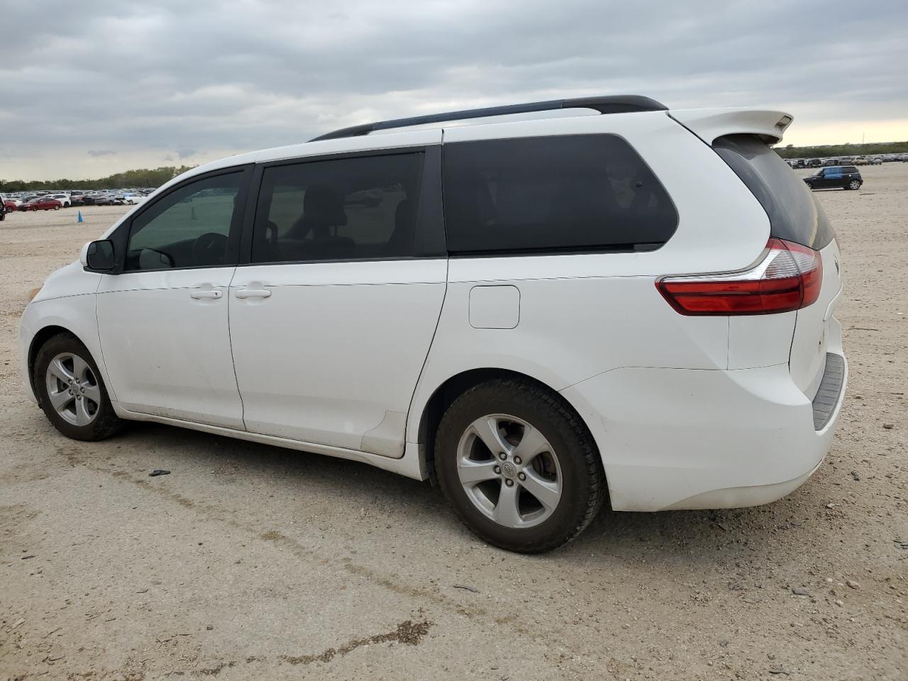 2015 Toyota Sienna VIN 5TDKK3DC0FS669769 Copart auction photo, side / front end damage thumbnail 2