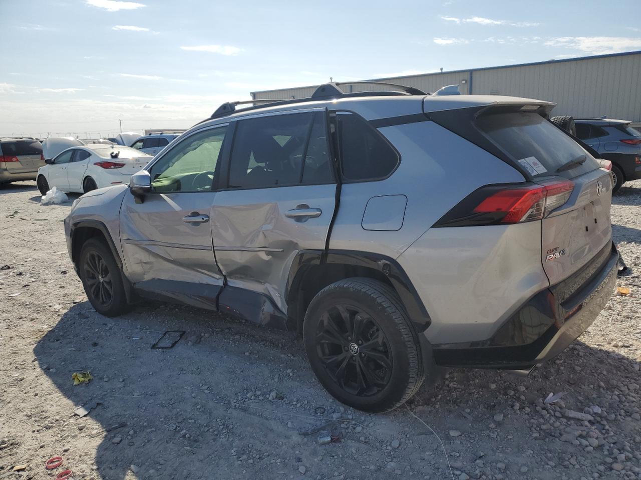 2023 Toyota RAV 4 VIN JTM16RFV1PD079708 Copart auction photo, side / mechanical damage thumbnail 2