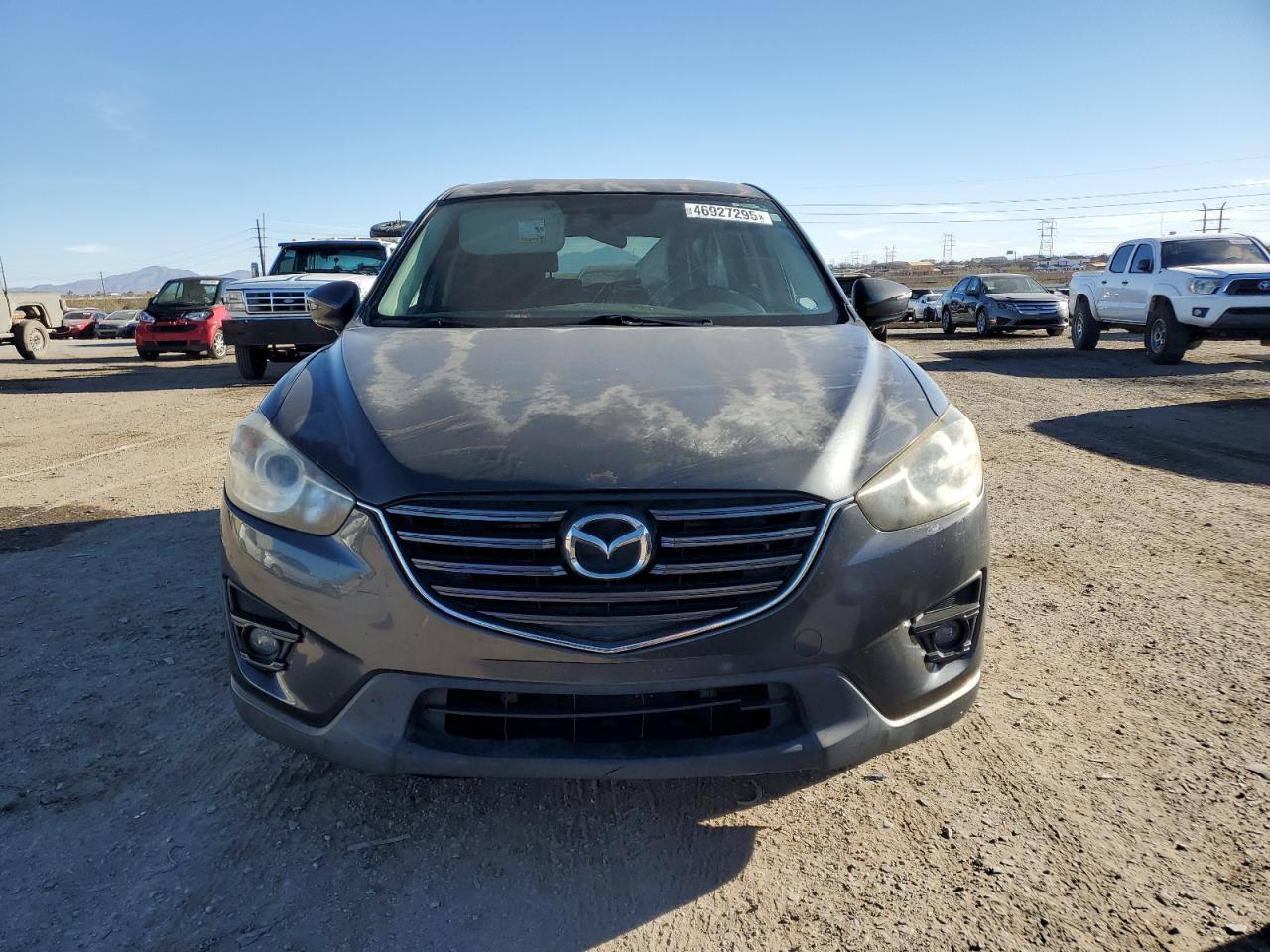 2016 Mazda CX-5 VIN JM3KE2CY0G0605399 Copart auction photo, rear end / front end damage thumbnail 5