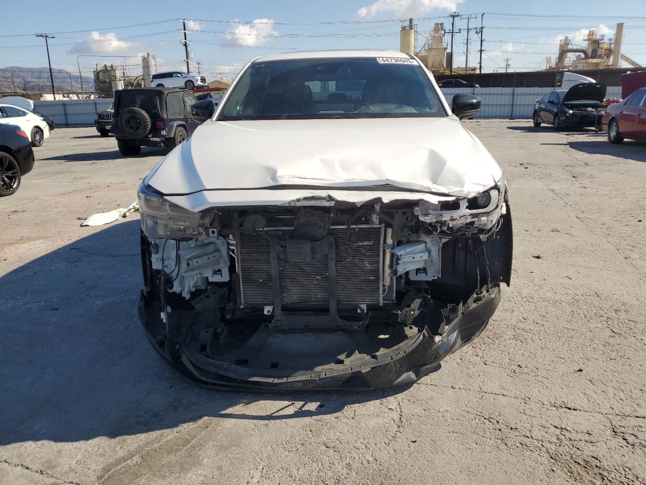 2022 Mazda CX-5 VIN JM3KFBAY5N0525299 Copart auction photo, front end / side damage thumbnail 5
