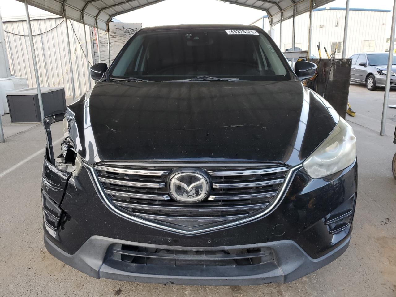 2016 Mazda CX-5 VIN JM3KE2DY5G0773537 Copart auction photo, front end damage thumbnail 5