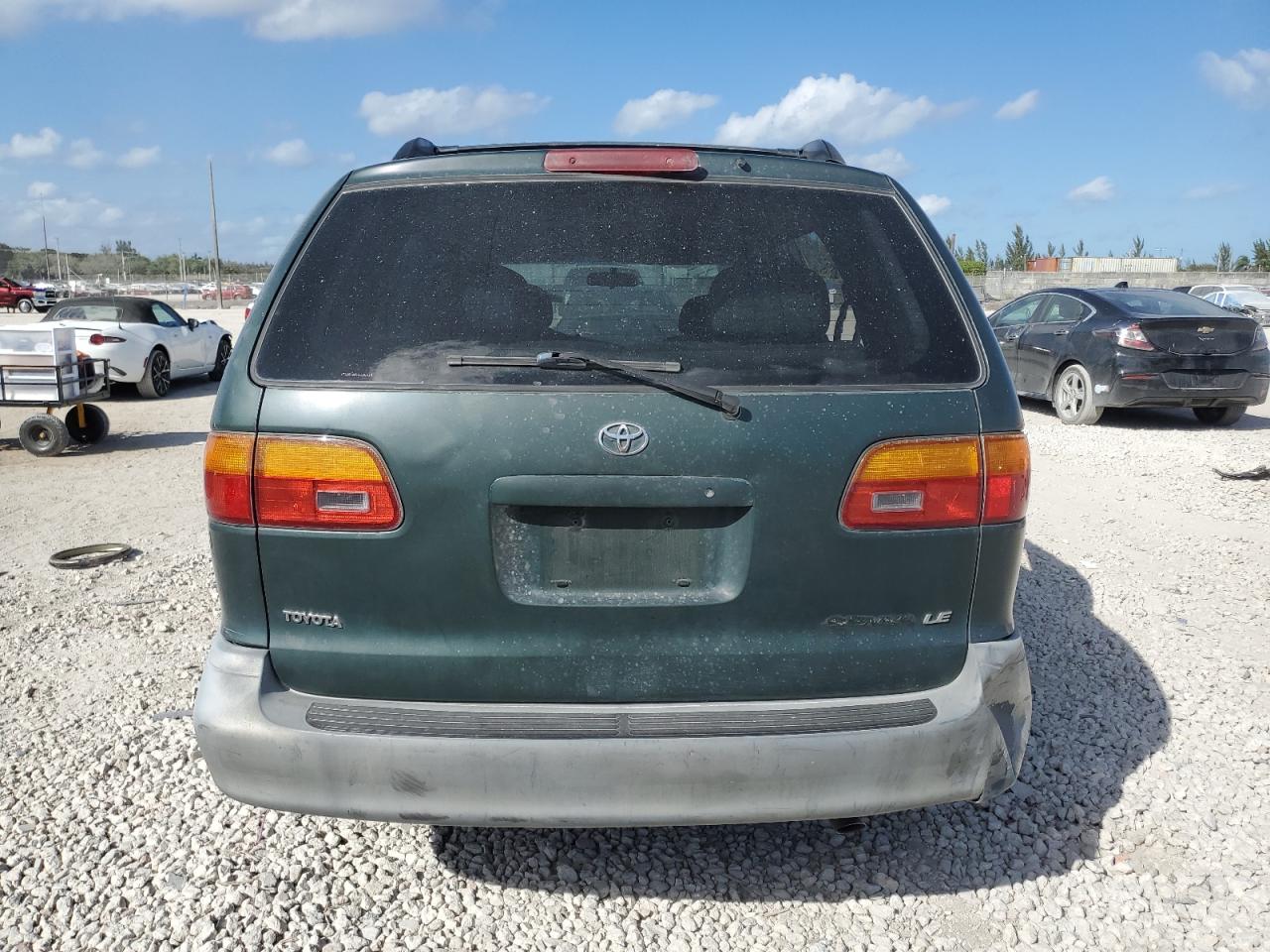 1999 Toyota Sienna VIN 4T3ZF13C1XU151498 Copart auction photo, side / mechanical damage thumbnail 6