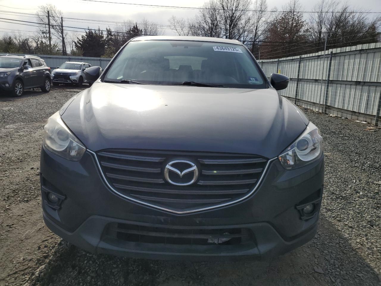 2016 Mazda CX-5 VIN JM3KE4DY5G0888974 Copart auction photo, side / rear end damage thumbnail 5