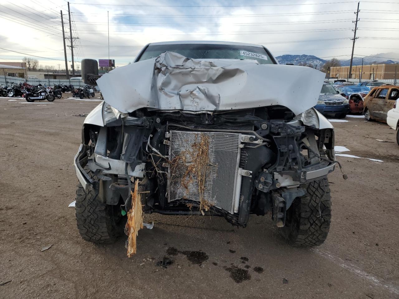 2011 Dodge RAM VIN 3D7UT2CL4BG591268 Copart auction photo, front end / side damage thumbnail 5