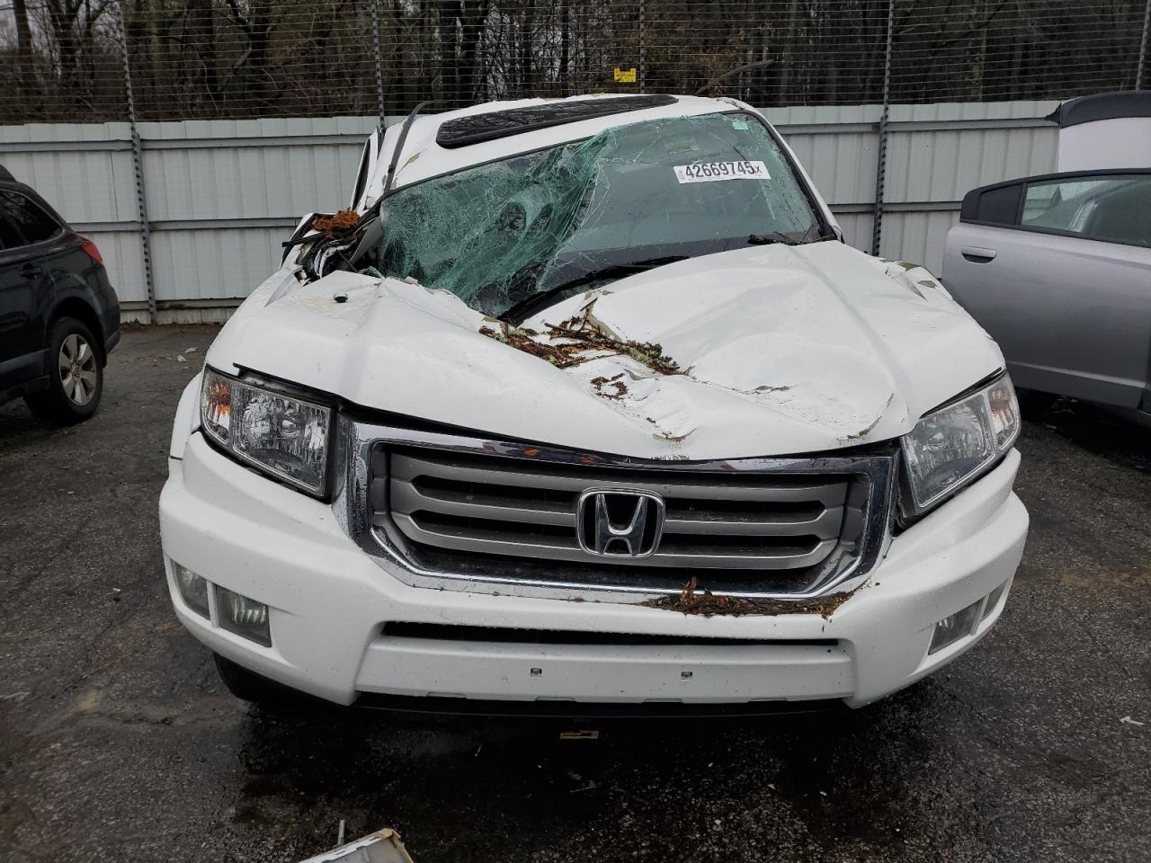 2013 Honda Ridgeline VIN 5FPYK1F55DB006445 Copart auction photo, front end / top/roof damage thumbnail 5