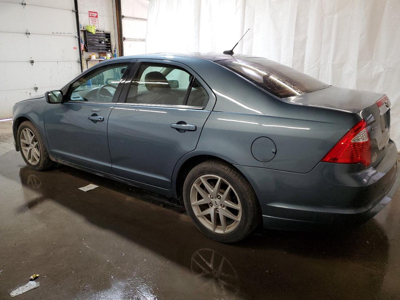 2012 Ford Fusion VIN 3FAHP0JA5CR228298 Copart auction photo, side / rear end damage thumbnail 2