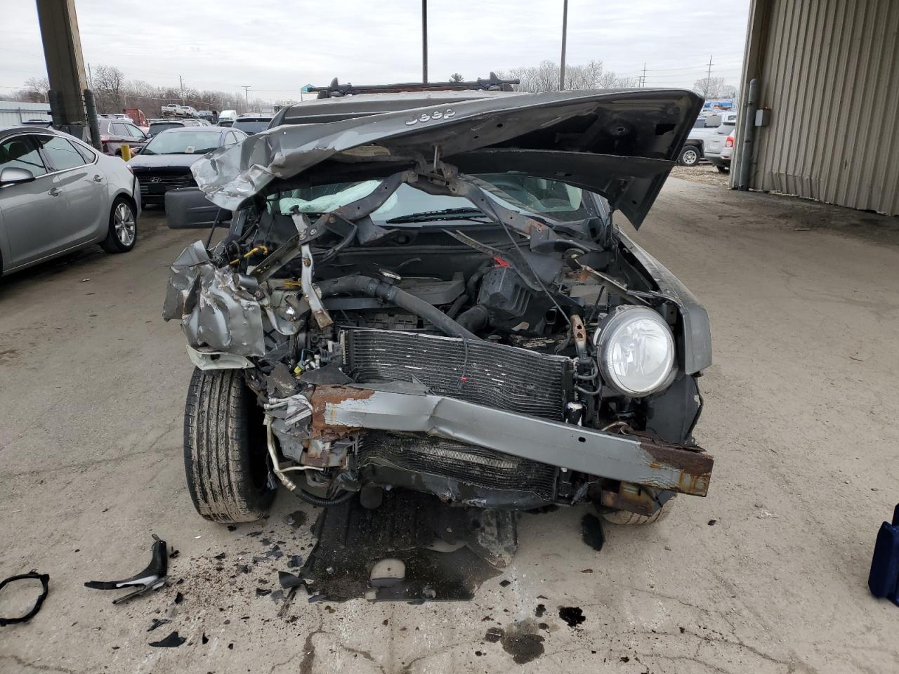2012 Jeep Liberty (Patriot) VIN 1C4NJRBB3CD621235 Copart auction photo, front end / side damage thumbnail 5