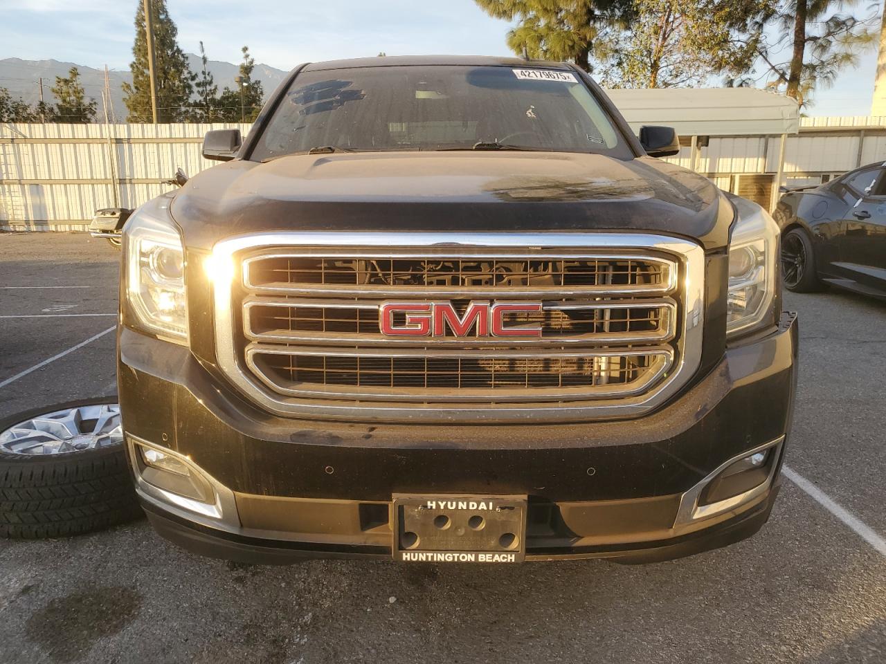 2015 GMC Yukon VIN 1GKS1BKC9FR144289 Copart auction photo, front end / undercarriage damage thumbnail 5