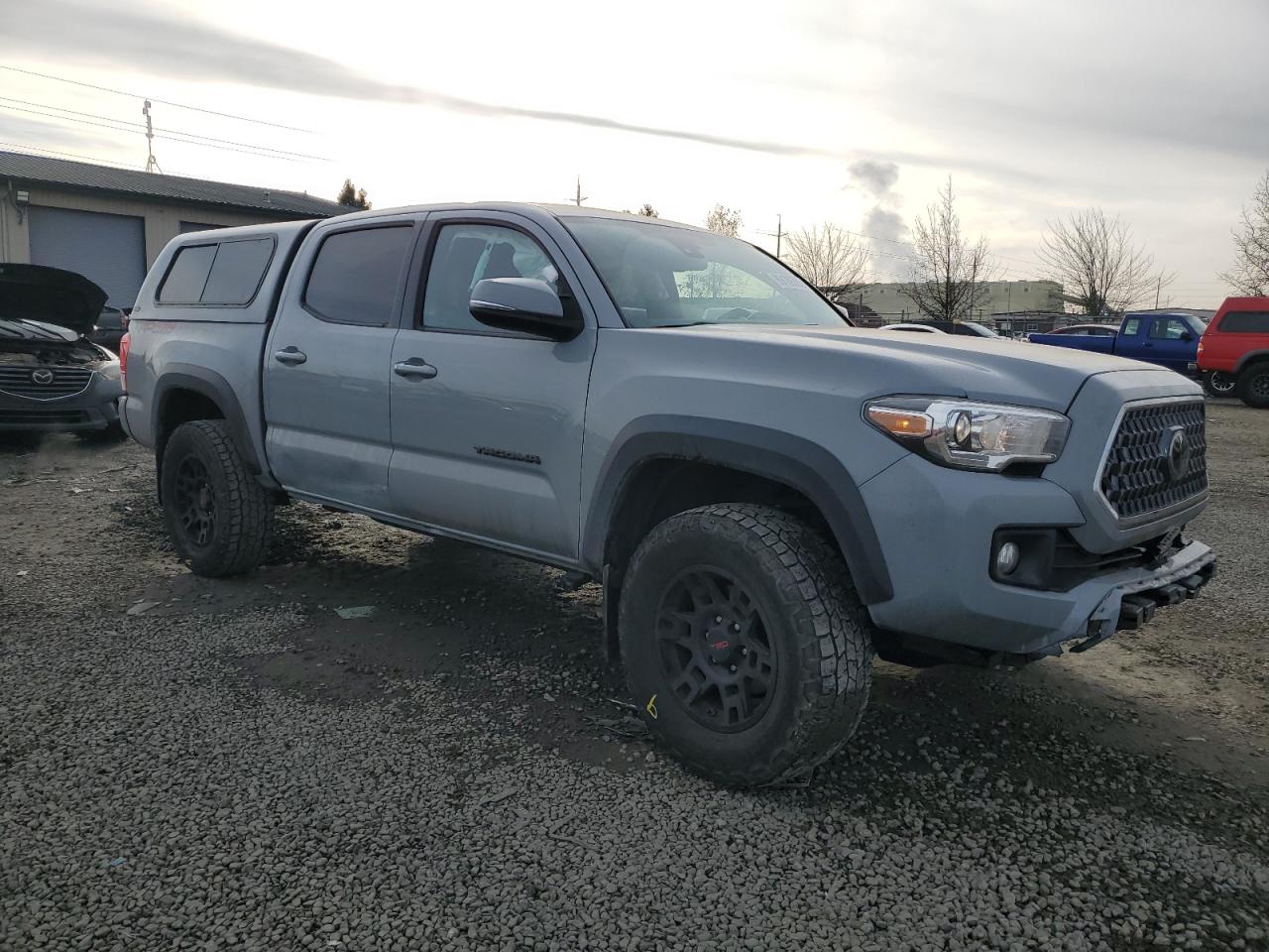 2019 Toyota Tacoma VIN 3TMCZ5AN3KM210361 Copart auction photo, front end / side damage thumbnail 4
