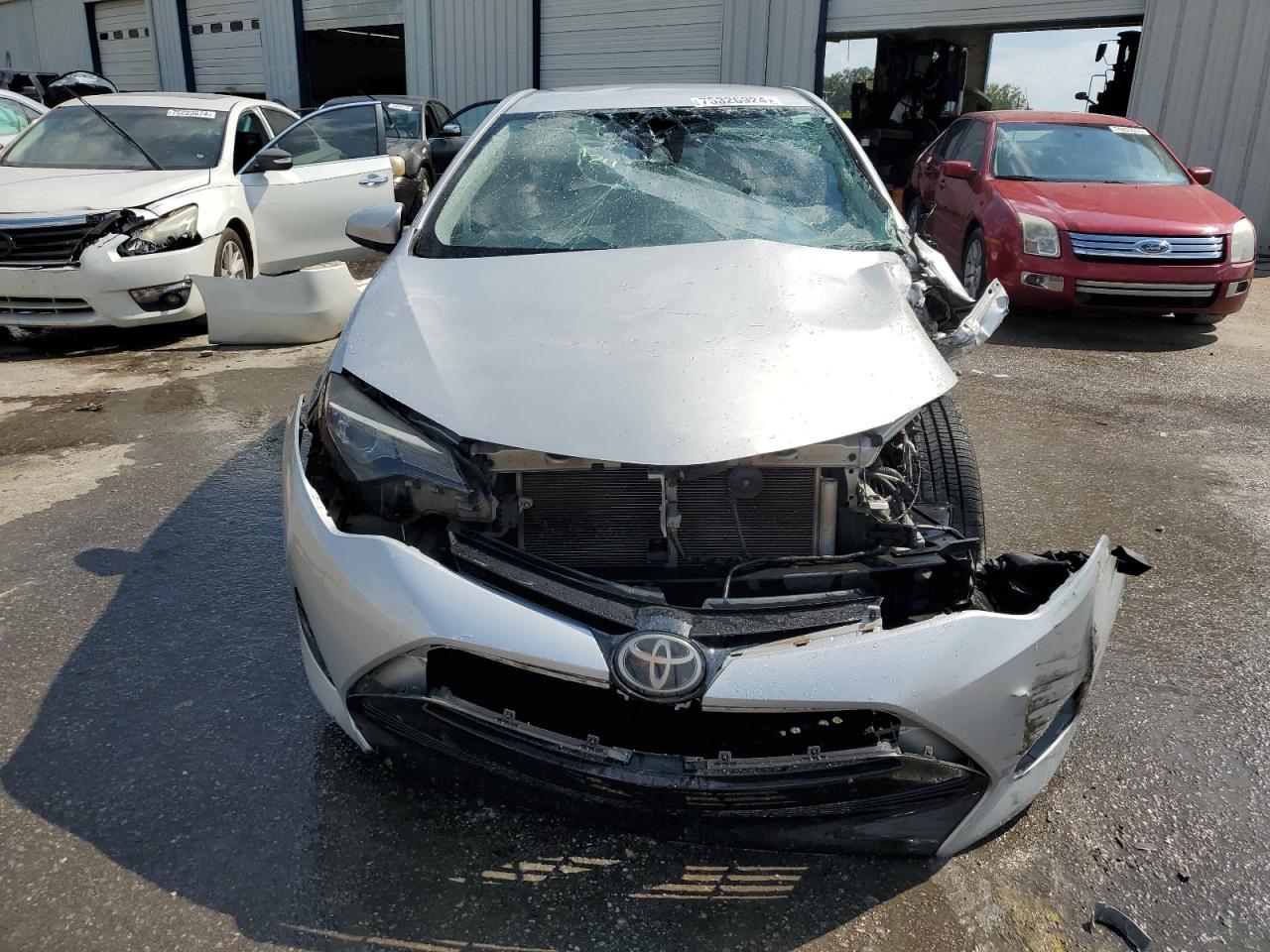 2017 Toyota Corolla VIN 5YFBURHE3HP653764 Copart auction photo, side / front end damage thumbnail 5
