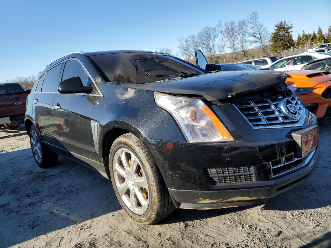 2015 Cadillac SRX VIN 3GYFNEE3XFS559871 Copart auction photo, burn damage thumbnail 4