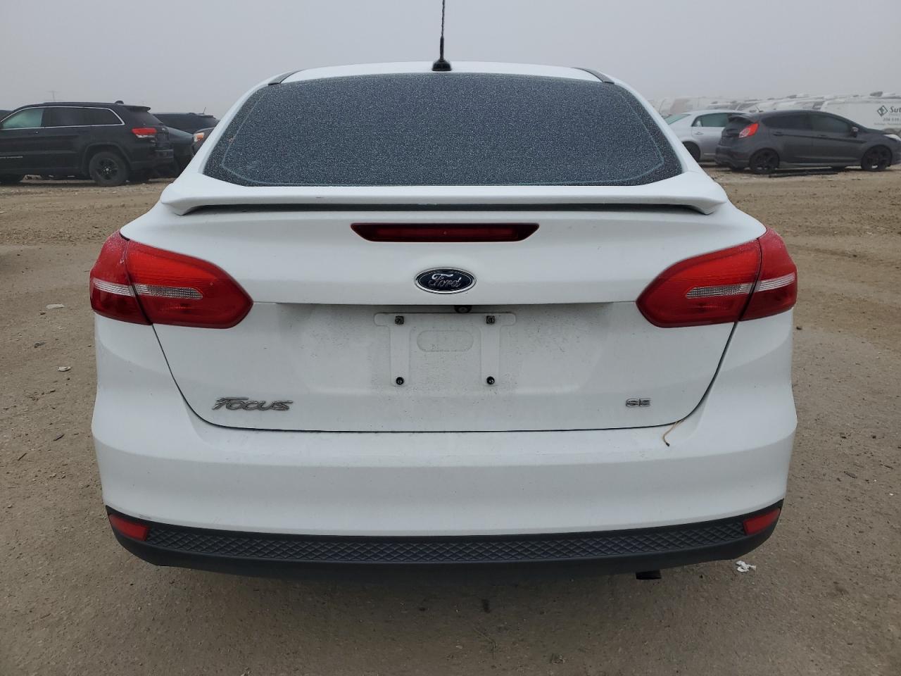 2016 Ford Focus VIN 1FADP3F20GL306556 Copart auction photo, all over damage thumbnail 6