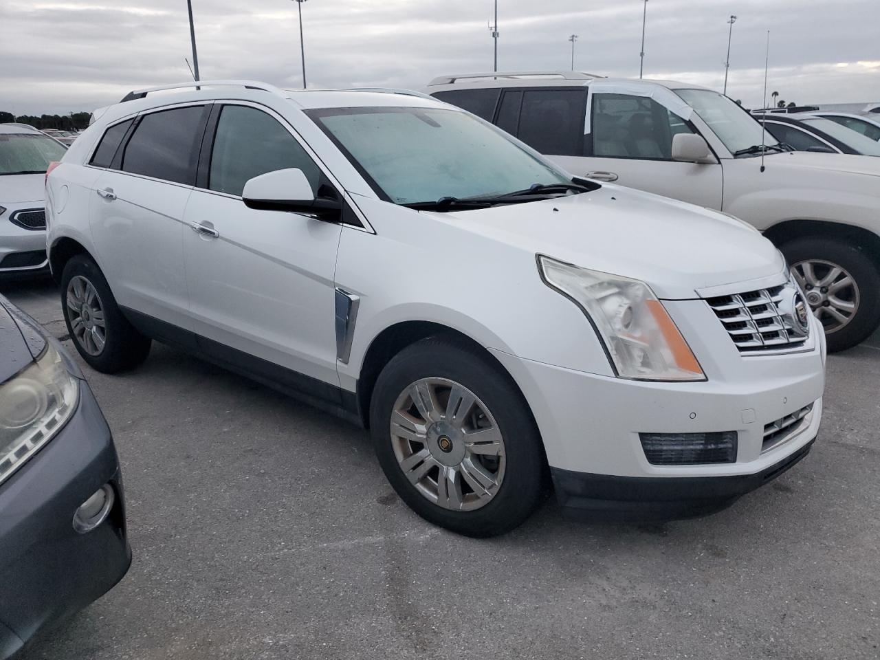 2015 Cadillac SRX VIN 3GYFNBE34FS550422 Copart auction photo, water/flood damage thumbnail 4