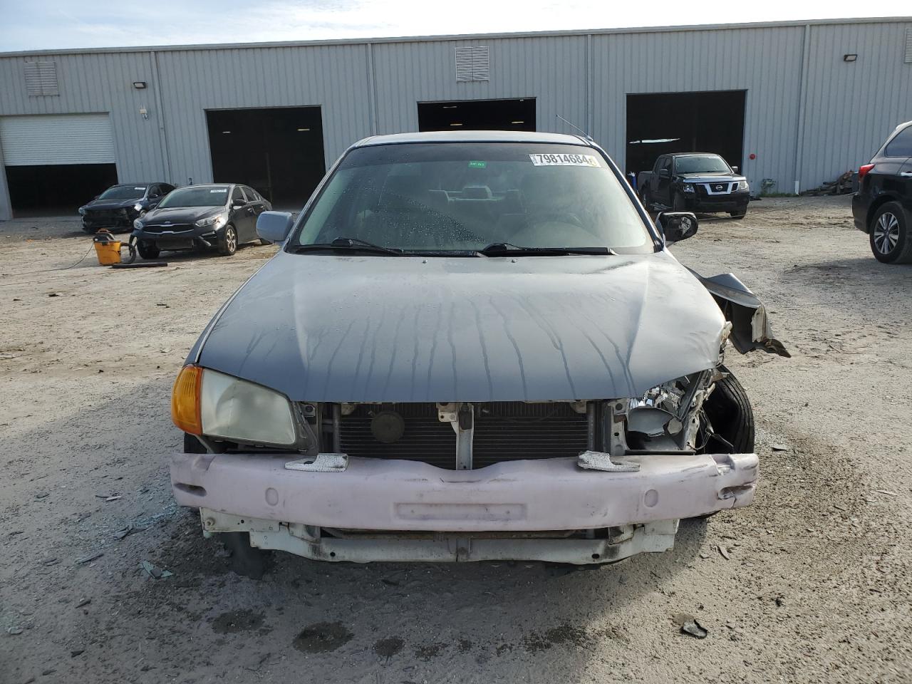 2000 Mazda Protege VIN JM1BJ2221Y0310055 Copart auction photo, front end / minor dent/scratches damage thumbnail 5