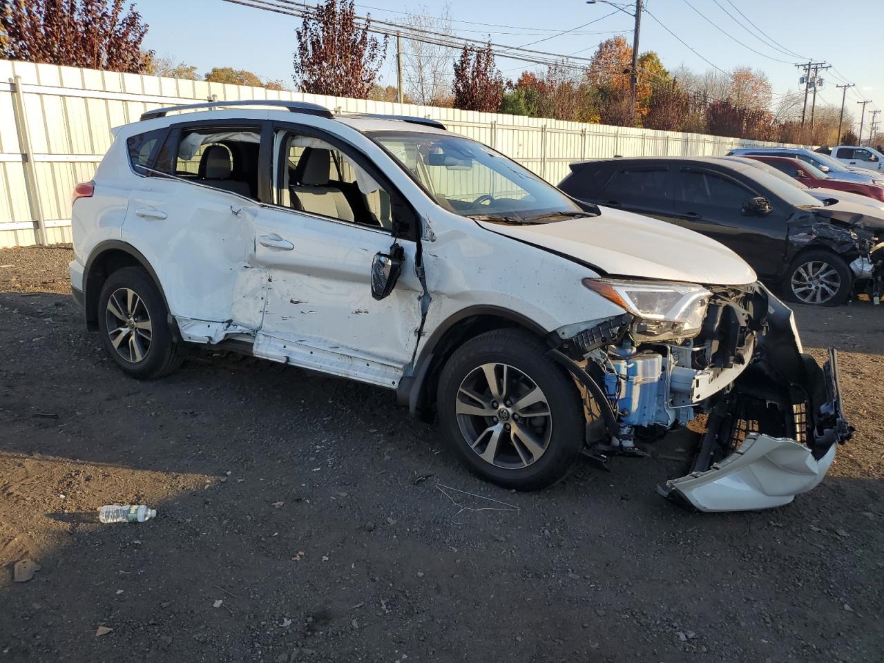 2018 Toyota RAV 4 VIN JTMRFREV3JJ185347 Copart auction photo, side / front end damage thumbnail 4