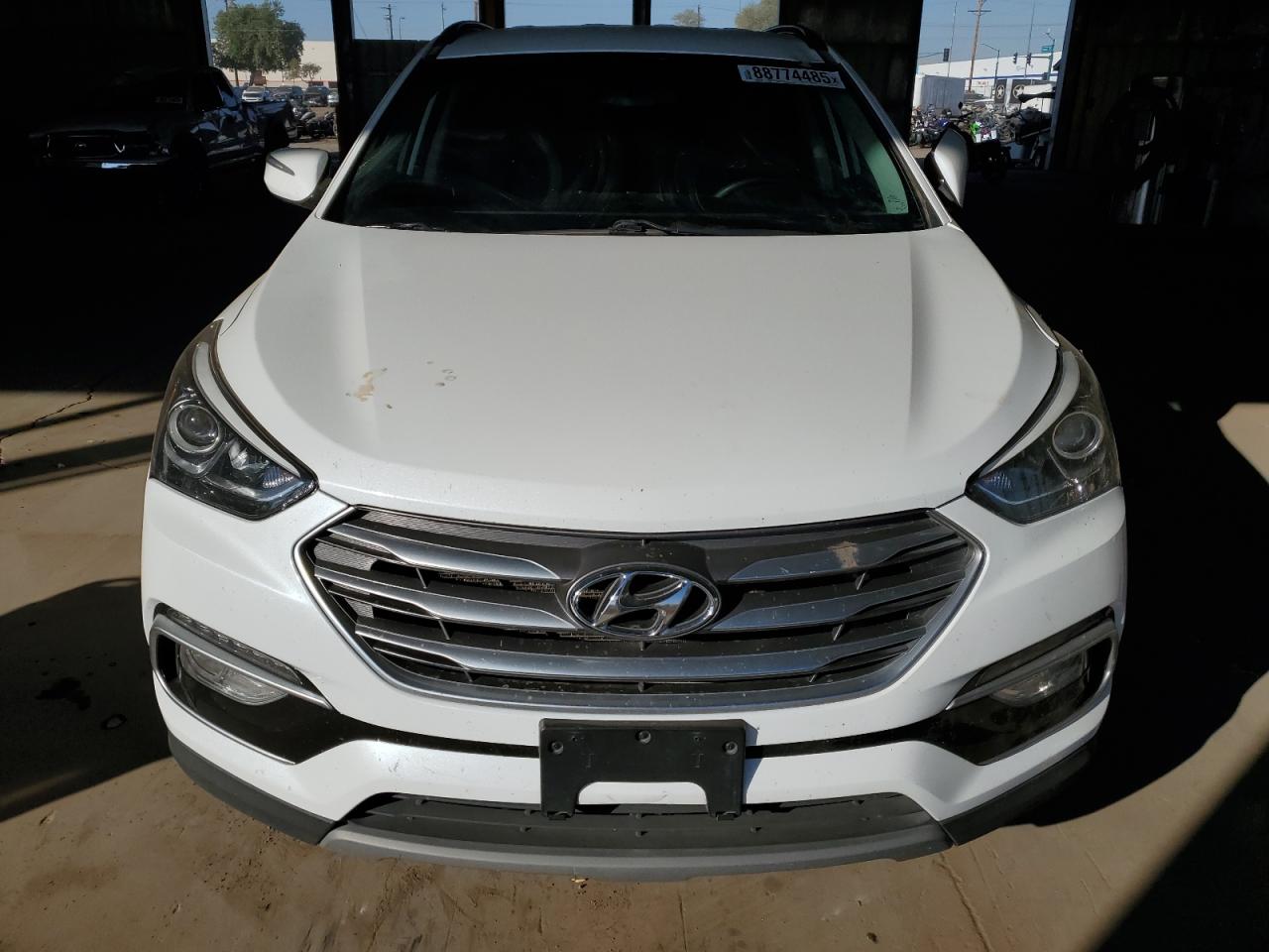2018 Hyundai Santa Fe VIN 5XYZU3LB4JG562277 Copart auction photo, front end / side damage thumbnail 5