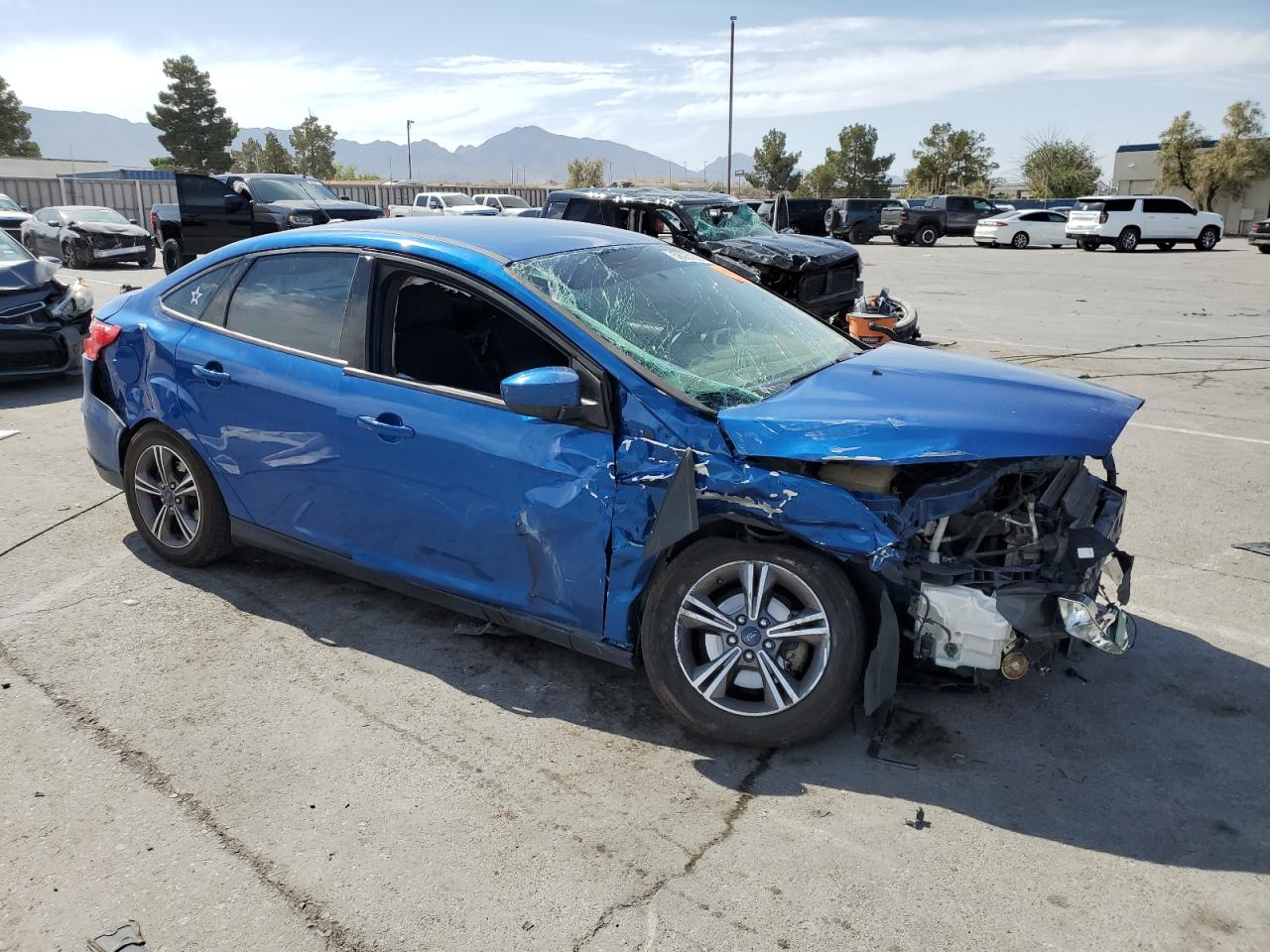 2018 Ford Focus VIN 1FADP3FE8JL275381 Copart auction photo, all over damage thumbnail 4