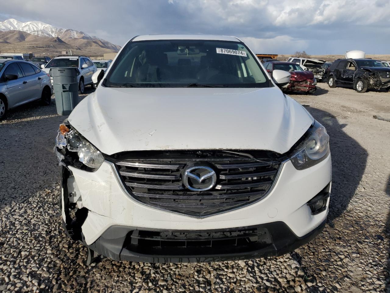 2016 Mazda CX-5 VIN JM3KE4DY2G0826240 Copart auction photo, front end / side damage thumbnail 5